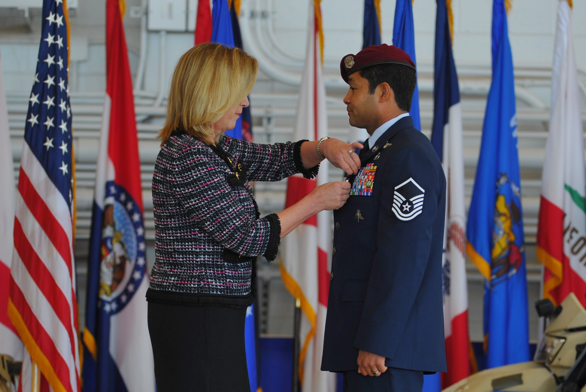 Secretary of the Air Force Deborah Lee James pins the Air Force Cross to the uniform of Master Sgt. Ivan Ruiz, a pararescueman from the 56th Rescue Squadron, Royal Air Force Lakenheath, England, during a ceremony at the Freedom Hangar on Hurlburt Field, Fla., Dec. 17, 2014. While deployed to Afghanistan with the 22nd Expeditionary Special Tactics Squadron, Ruiz protected his injured special operations forces teammates with fire support and provided emergency medical care under intense enemy fire in the dark, Dec. 10, 2013. The last six Air Force Crosses have all been awarded to AFSOC Special Tactics Airmen. (U.S. Air Force photo/Senior Airman Christopher Callaway) 