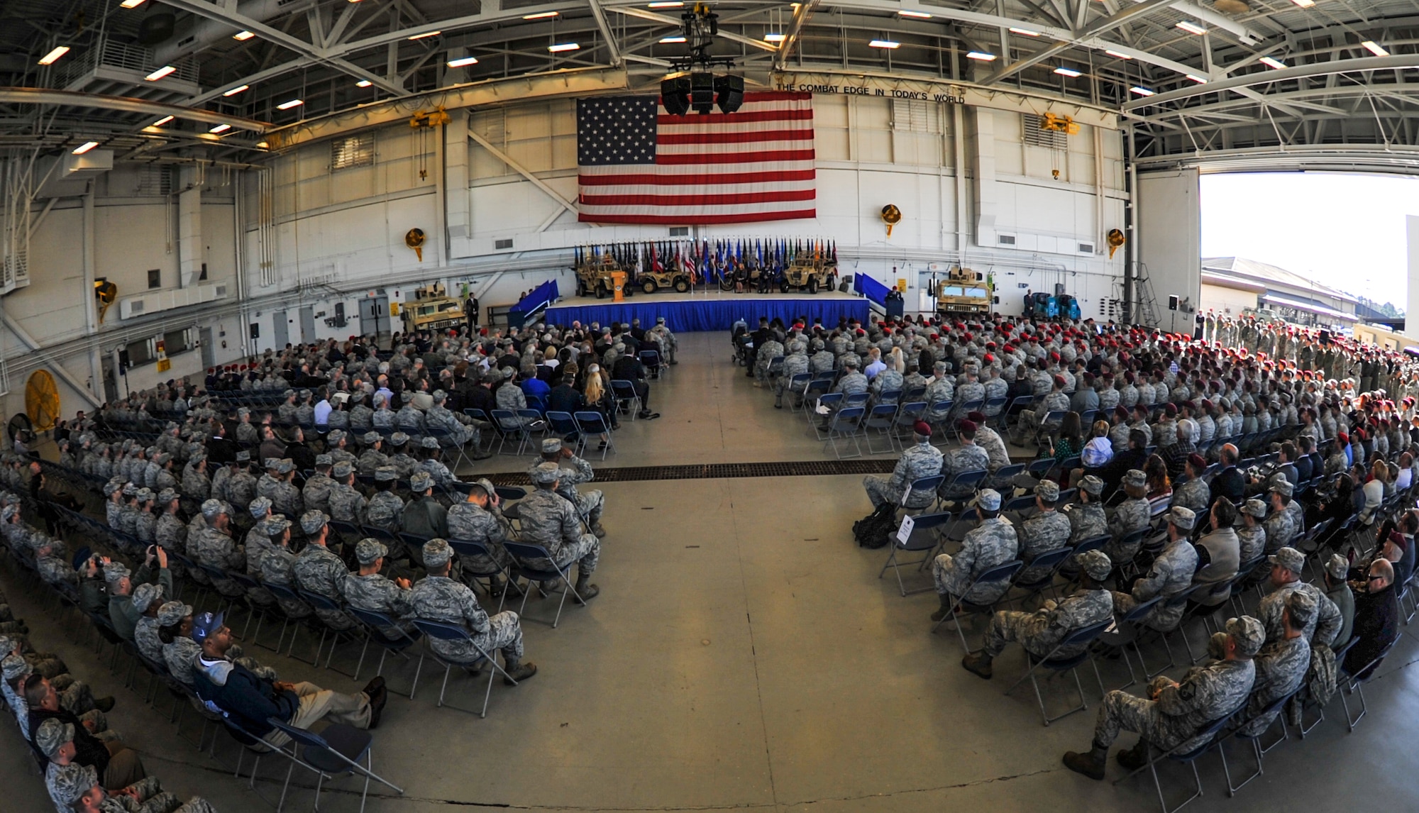 Air Commandos and members of the community gather in the Freedom Hangar for a ceremony recognizing Master Sgt. Ivan Ruiz, a pararescueman from the 56th Rescue Squadron, Royal Air Force Lakenheath, England, who was awarded the Air Force Cross on Hurlburt Field, Fla., Dec. 17, 2014. Ruiz was also awarded a Bronze Star with Valor for actions taken and a Bronze Star for his tour during the same deployment to Afghanistan from July 2013 to January 2014 with Army Special Forces.  The last six Air Force Crosses have all been awarded to AFSOC Special Tactics Airmen. (U.S. Air Force photo/Senior Airman Christopher Callaway) 