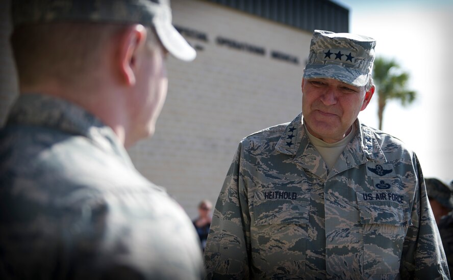 Lt. Gen. Bradley Heithold, Air Force Special Operations Command commander, speaks with an Airman while at the 1st Special Operations Medical Group during his tour of Hurlburt Field, Fla., Dec. 11, 2014. Heithold discussed various subjects such as, the AFSOC mission and the importance of family. (U.S. Air Force photo/Senior Airman Krystal M. Garrett) 