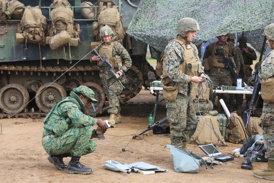 Marines with 1st Battalion, 5th Marine Regiment, 1st Marine Division, along with elements of the 7th Singaporean Infantry Brigade, clear a combat town as part of Exercise Valiant Mark 14.2 aboard Camp Pendleton, Calif., Dec. 15, 2014. Exercise Valiant Mark enhances the United States and Singaporean armed forces’ combined combat readiness through live-fire and urban terrain training as well as amphibious operations familiarization.