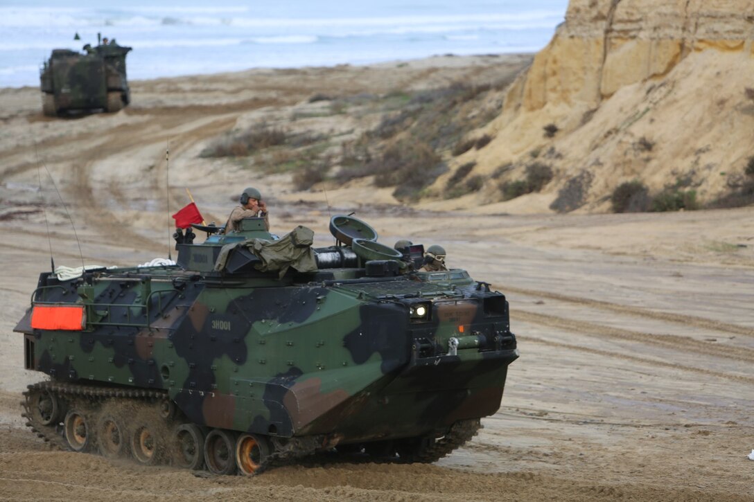 Marines with 1st Battalion, 5th Marine Regiment, 1st Marine Division, along with elements of the 7th Singaporean Infantry Brigade, clear a combat town as part of Exercise Valiant Mark 14.2 aboard Camp Pendleton, Calif., Dec. 15, 2014. Exercise Valiant Mark enhances the United States and Singaporean armed forces’ combined combat readiness through live-fire and urban terrain training as well as amphibious operations familiarization.