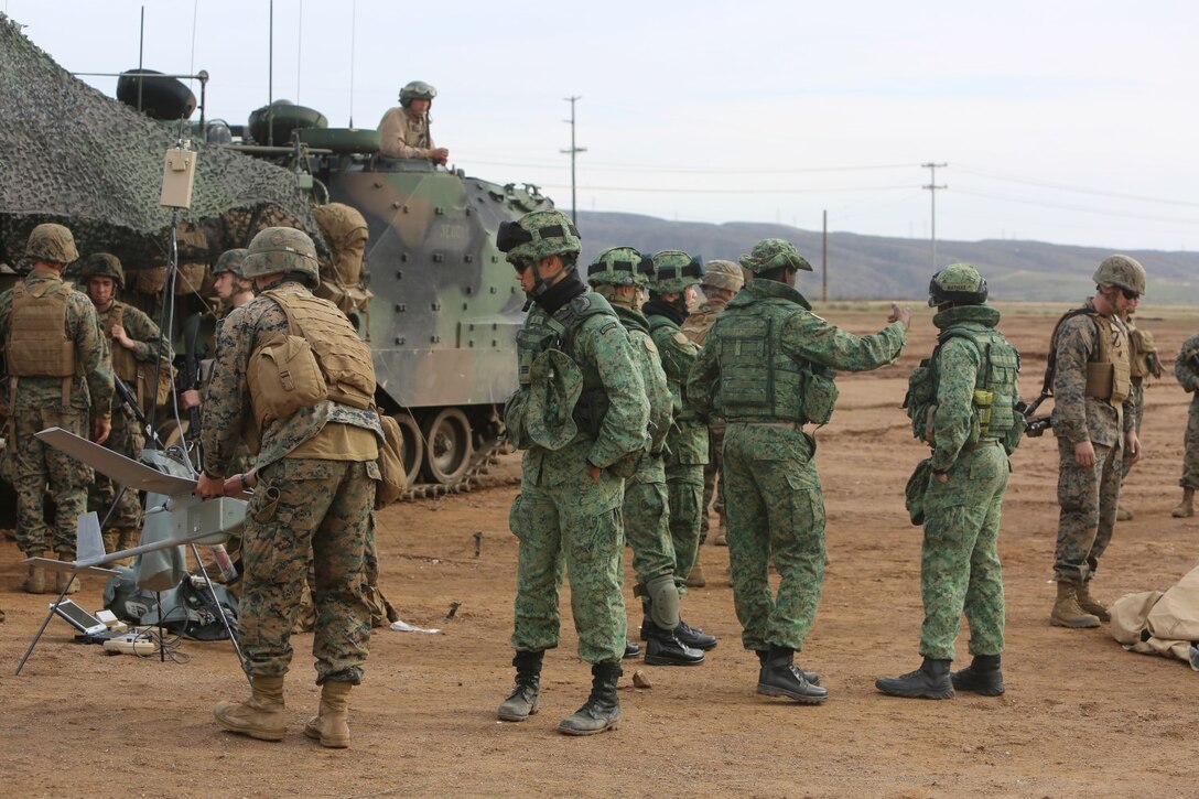 Marines with 1st Battalion, 5th Marine Regiment, 1st Marine Division, along with elements of the 7th Singaporean Infantry Brigade, clear a combat town as part of Exercise Valiant Mark 14.2 aboard Camp Pendleton, Calif., Dec. 15, 2014. Exercise Valiant Mark enhances the United States and Singaporean armed forces’ combined combat readiness through live-fire and urban terrain training as well as amphibious operations familiarization.