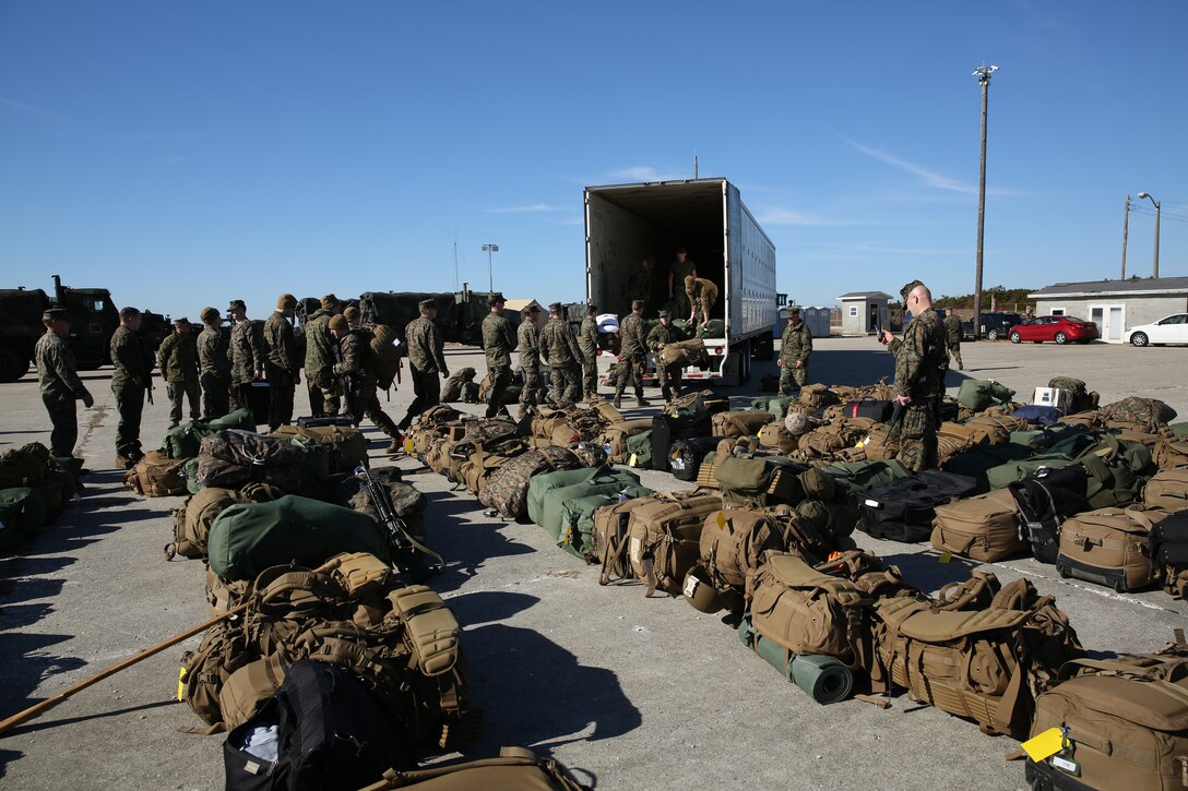 Marines with the 24th Marine Expeditionary Unit stage equipment and bags at Morehead City, N.C., Dec. 13. The 24th MEU embarked on the ships of the Iwo Jima Amphibious Ready Group for their 2015 deployment Dec. 12-14. The 24th MEU is scheduled to support operations in the 5th and 6th Fleet areas of responsibility.
