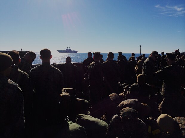 Marines with the 24th Marine Expeditionary Unit ride a Navy Landing Craft, Utility, or LCU, to the USS Iwo Jima off the coast of Morehead City, N.C., Dec. 14. The 24th MEU embarked on the ships of the Iwo Jima Amphibious Ready Group for their 2015 deployment Dec. 12-14. The 24th MEU is scheduled to support operations in the 5th and 6th Fleet areas of responsibility.