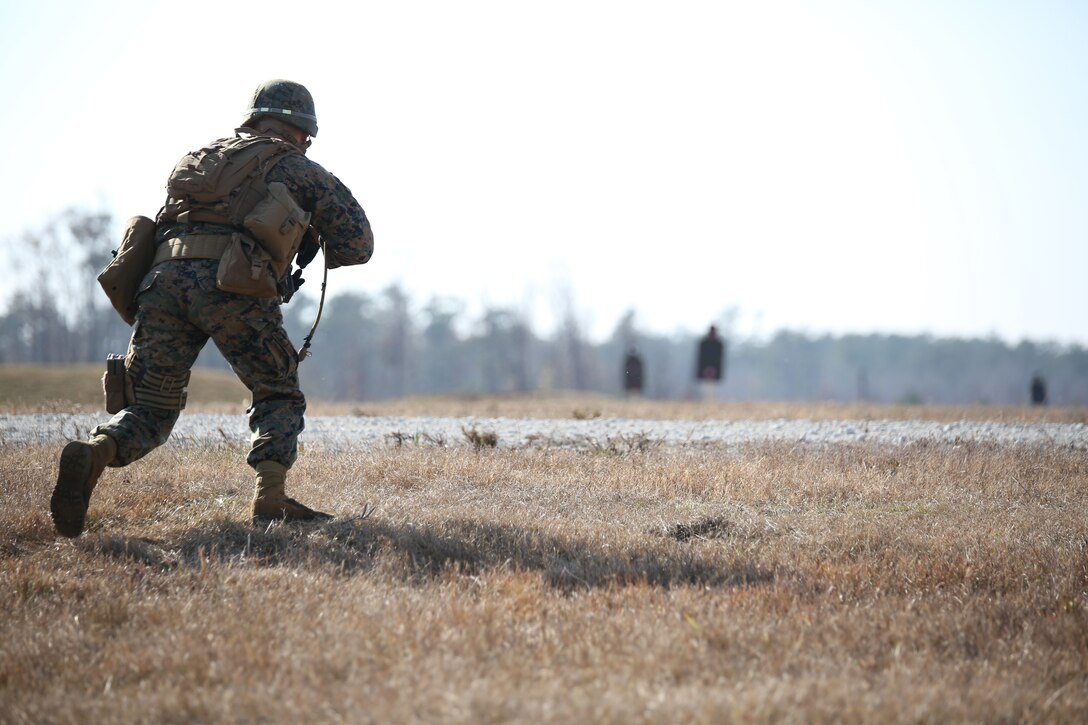 Cpl. Ramses Chavez, rifleman, Company A, Ground Combat Element Integrated Task Force, conducts a movement under simulated fire during a fire team collective skills exercise at Range K509, Marine Corps Base Camp Lejeune, North Carolina, Dec. 16, 2014. The assault served as the company’s first collective skills-level exercise. From October 2014 to July 2015, the Ground Combat Element Integrated Task Force will conduct individual and collective skills training in designated combat arms occupational specialties in order to facilitate the standards based assessment of the physical performance of Marines in a simulated operating environment performing specific ground combat arms tasks. (U.S. Marine Corps photo by Cpl. Paul S. Martinez/Released)