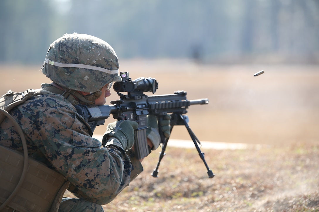 Lance Cpl. Jose Damoeda, rifleman, Company A, Ground Combat Element Integrated Task Force, fires an M27 Infantry Automatic Rifle during a fire team collective skills exercise at Range K509, Marine Corps Base Camp Lejeune, North Carolina,  Dec. 16, 2014. The assault served as the company’s first collective skills-level exercise. From October 2014 to July 2015, the Ground Combat Element Integrated Task Force will conduct individual and collective skills training in designated combat arms occupational specialties in order to facilitate the standards based assessment of the physical performance of Marines in a simulated operating environment performing specific ground combat arms tasks. (U.S. Marine Corps photo by Cpl. Paul S. Martinez/Released)