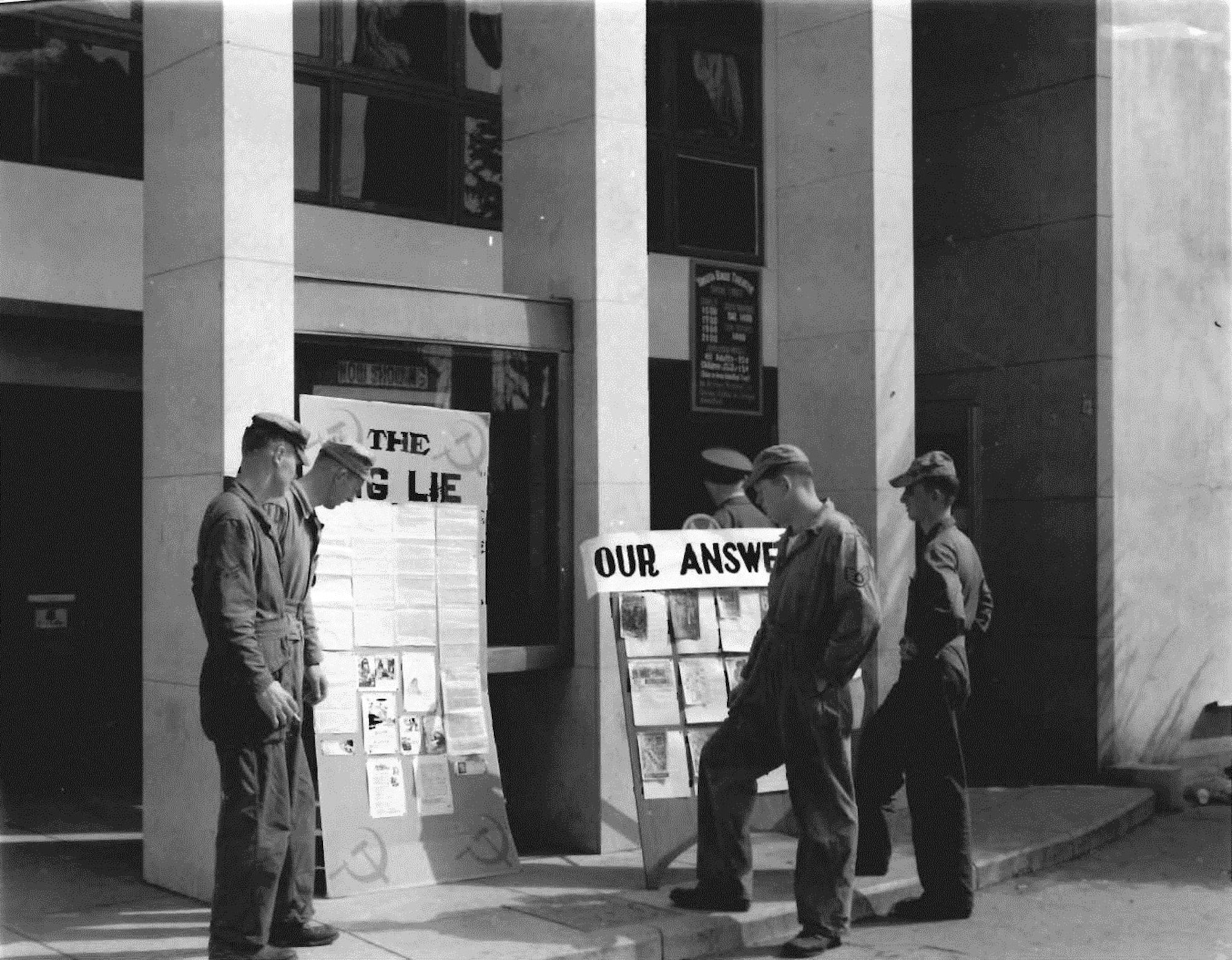 This Mid-April 1952 photo was taken in front of the Yokota theater where a lecture
about the Communist menace was held. (U.S. Air Force photo courtesy of the 374th
Airlift Wing History Office)
