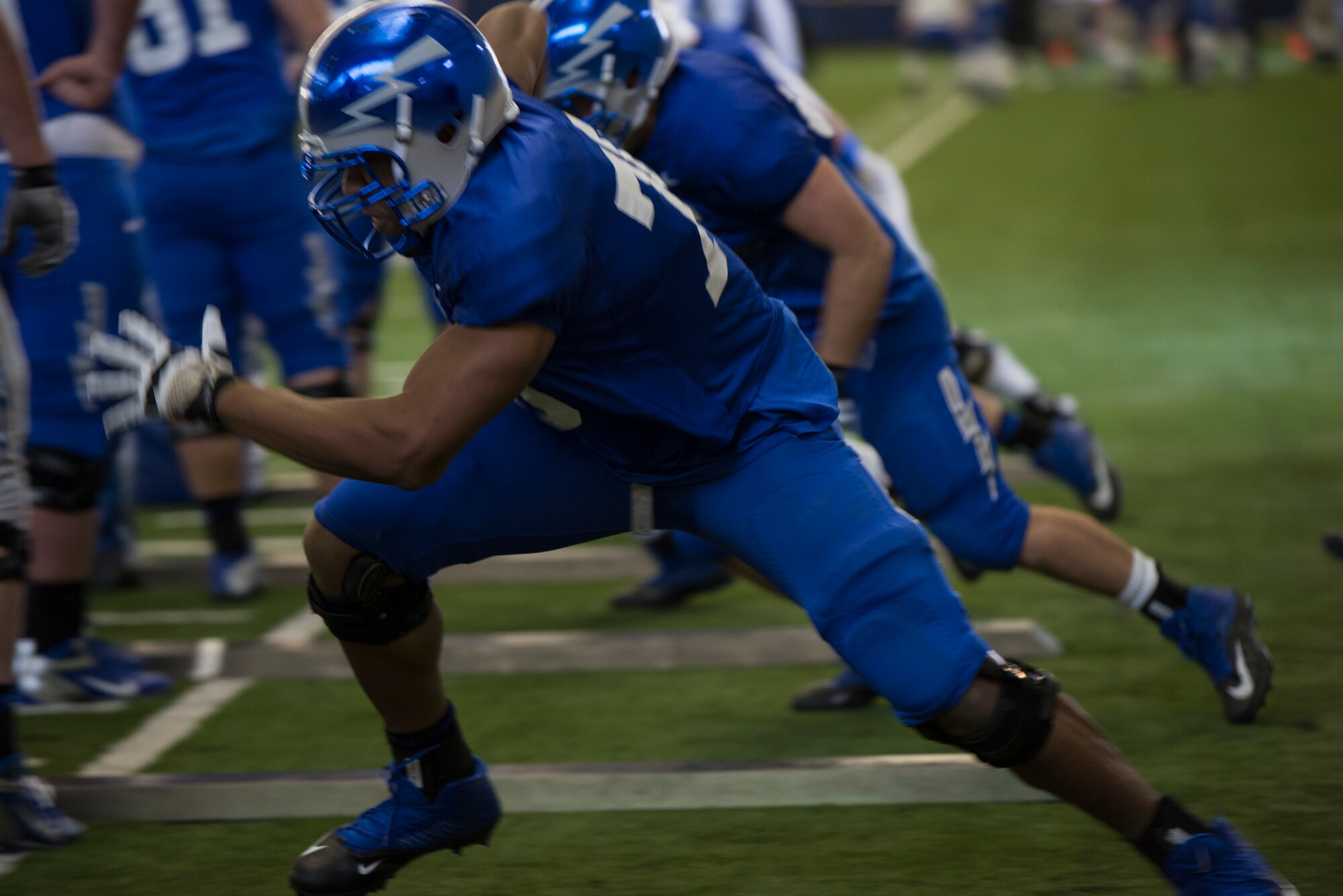 Air Force Academy football players perfect their form of tackling during practice at the Caven Williams Sports Complex in Boise, Idaho, Dec. 17, 2014. The Falcons are scheduled to play in the Famous Idaho Potato Bowl against the Western Michigan Broncos Dec. 20, 2014. (U.S. Air Force photo by Airman 1st Class Jessica H. Smith/RELEASED)