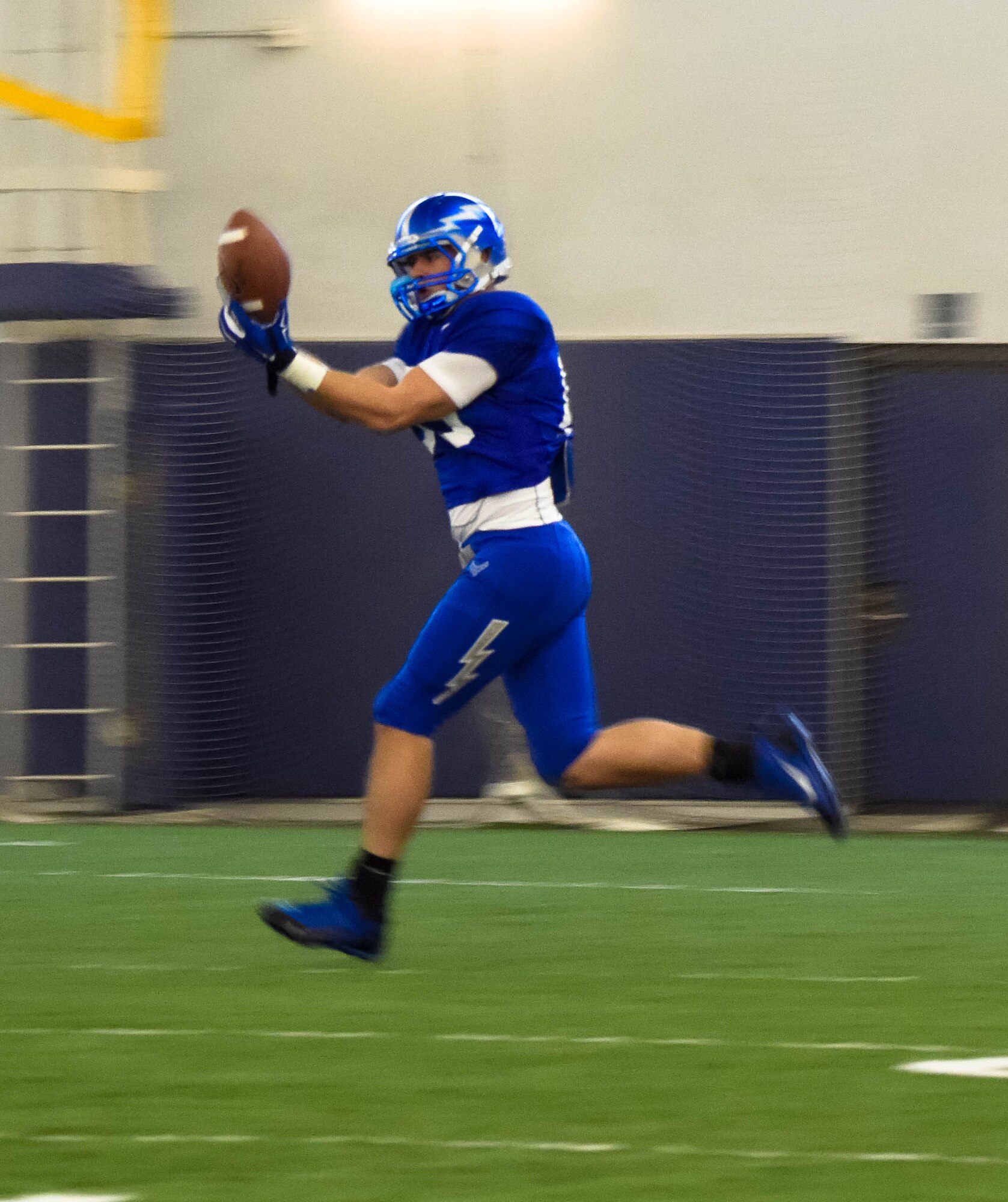 An Air Force Falcon player makes a catch during practice Dec. 17, 2014, at the Caven Williams Sports Complex in Boise, Idaho. The Falcons are preparing for the Famous Idaho Potato Bowl Dec. 20, against the Western Michigan Broncos. (U.S. Air Force photo by Airman 1st Class Jeremy L. Mosier/RELEASED)