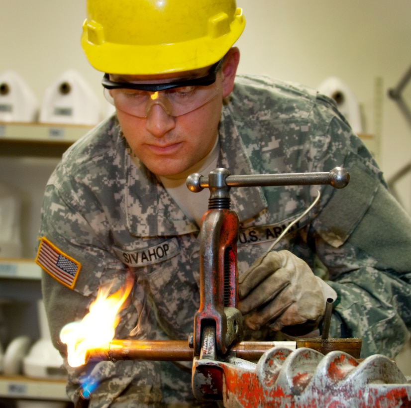 Army pfc. Ryan Sivahop, Delta Company 169th Engineer Battalion, uses a
blowtorch to solder copper pipe during a water and fuel systems maintenance
course plumbing class at Sheppard Air Force Base, Texas, Dec. 5, 2014.
Students troubleshoot plumbing systems and make repairs so all fixtures
operate properly. (U.S. Air Force Photo Danny Webb/Released)
