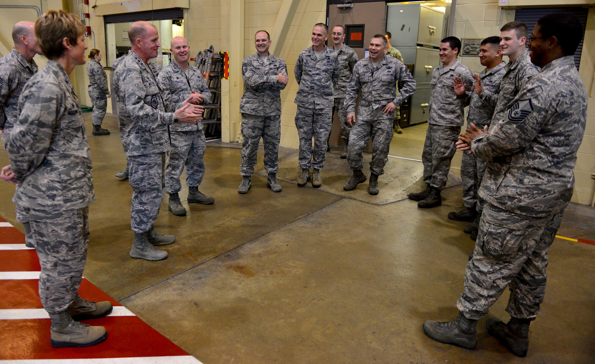 Lt. Gen. Stephen Wilson, commander of Air Force Global Strike Command, speaks with Airmen from the 2nd Maintenance Squadron phase hangar on Barksdale Air Force Base, La., Dec. 16, 2014. Wilson toured the facility and was briefed by different Airmen on their functions and responsibilities.(U.S. Air Force photo/Airman 1st Class Mozer O. Da Cunha) 