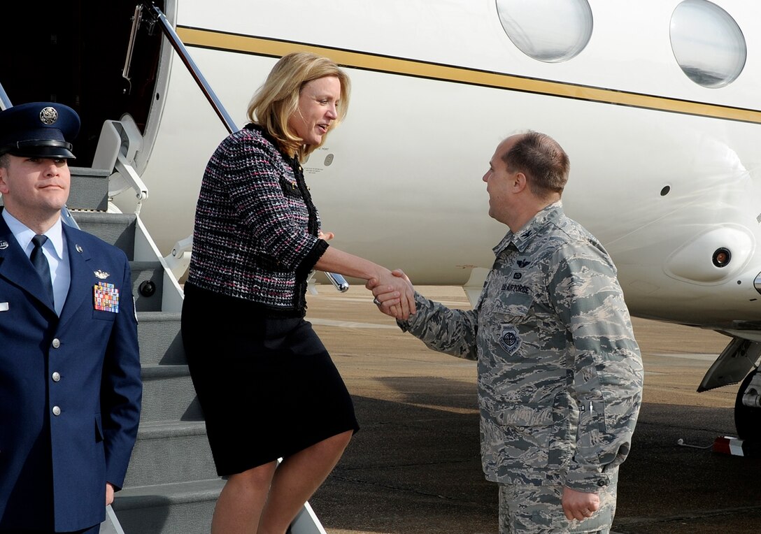 The Honorable Deborah Lee James, Secretary of the Air Force, is greeted by Col. John Nichols, 14th Flying Training Wing Commander, after arriving at Columbus Air Force Base Dec. 17. During her visit she will tour several squadrons and organizations to meet with Airmen and learn their unique capabilities, key initiatives, attributes and missions. (U.S. Air Force photo/Elizabeth Owens)