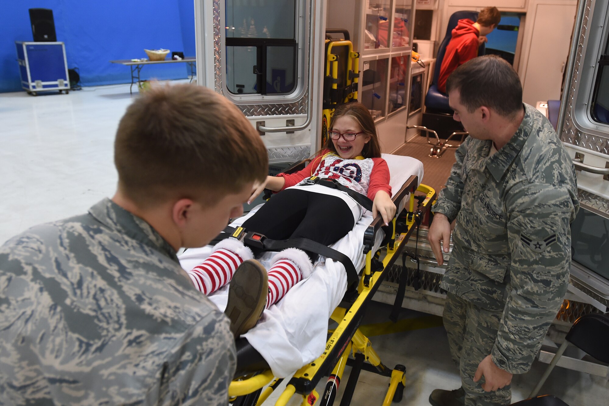 Kaitlyn, daughter of U.S. Army 1st. Sgt. Stormy Knowles, plays in a gurney during the Parents and Children Fighting Cancer Holiday Party on Joint Base Andrews, Md., Dec. 13, 2014.  Knowles’ son was diagnosed with acute lymphocytic leukemia in 2001 and received treatment through Walter Reed National Military Medical Center. (U.S. Air Force photo/ Senior Airman Nesha Humes)