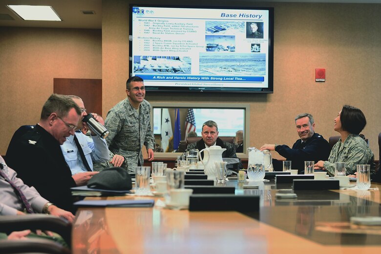 Adm. William Gortney, commander of North American Aerospace Defense Command and U.S. Northern Command, seated center, is briefed on Buckley Air Force Base mission capabilities during a tour Dec. 16, 2014, on Buckley AFB, Colo. Gortney assumed command Dec. 5, 2014, of NORAD/NORTHCOM and toured Buckley to familiarize himself with the base and its mission. (U.S. Air Force photo by Airman 1st Class Luke Nowkowski/Released) 
