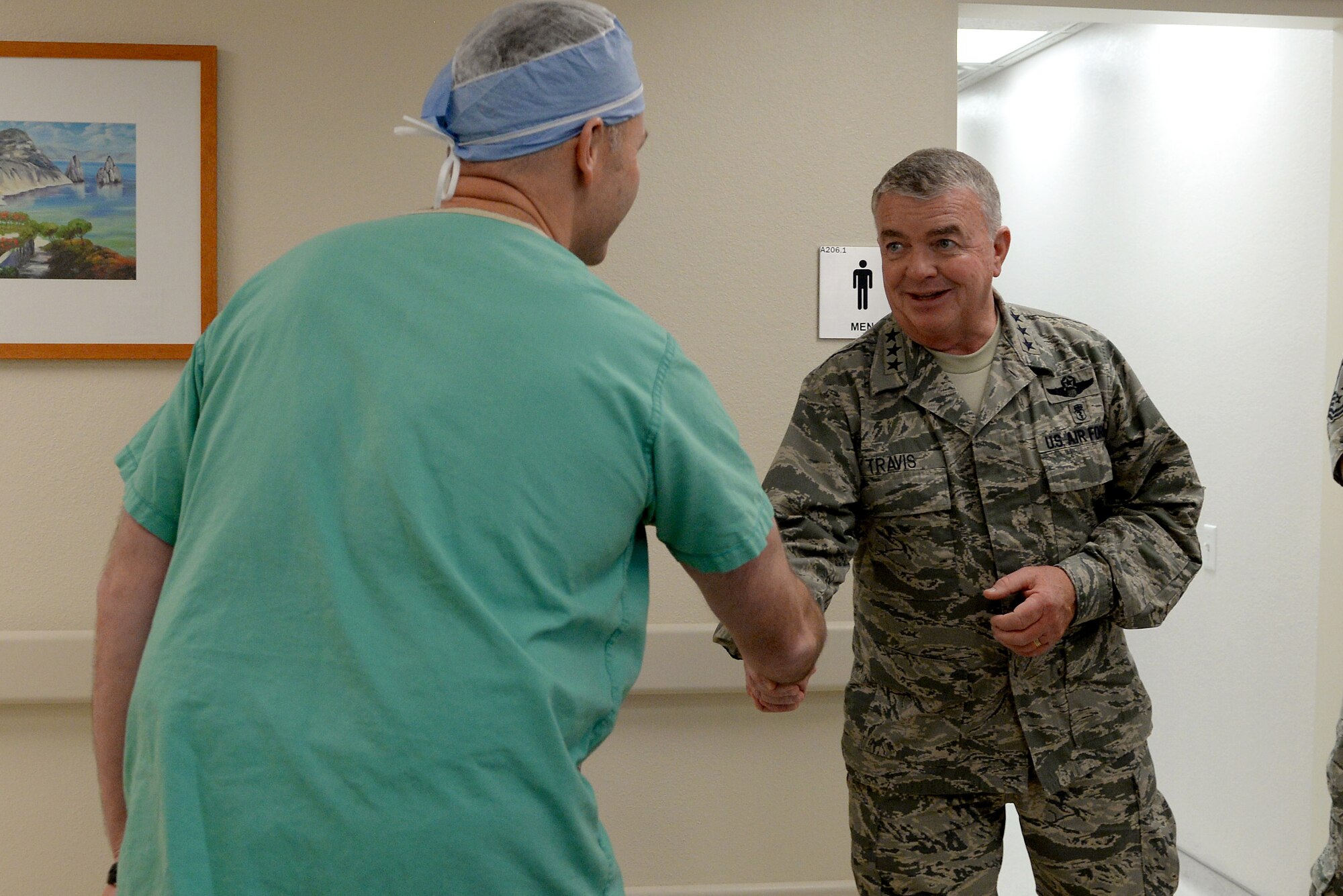 Lt. Gen. Thomas Travis, Air Force Surgeon General, visited Scott Air Force Base, Ill. for the first time Dec. 8, 2014. General Travis toured the many clinics in the 375th Medical Group Dec. 10, 2014 after speaking about leadership at a 375th MDG all-call. Throughout the day, he recognized many airmen for the hard work they have accomplished. Members of the 375th MDG also briefed General Travis about their clinic’s mission and goals. General Travis had a chance to visit the 375th Aeromedical Evacuation Squadron and Belleville Family Clinic as well. (U.S. Air Force photo/ Airman 1st Class Kiana Brothers) 