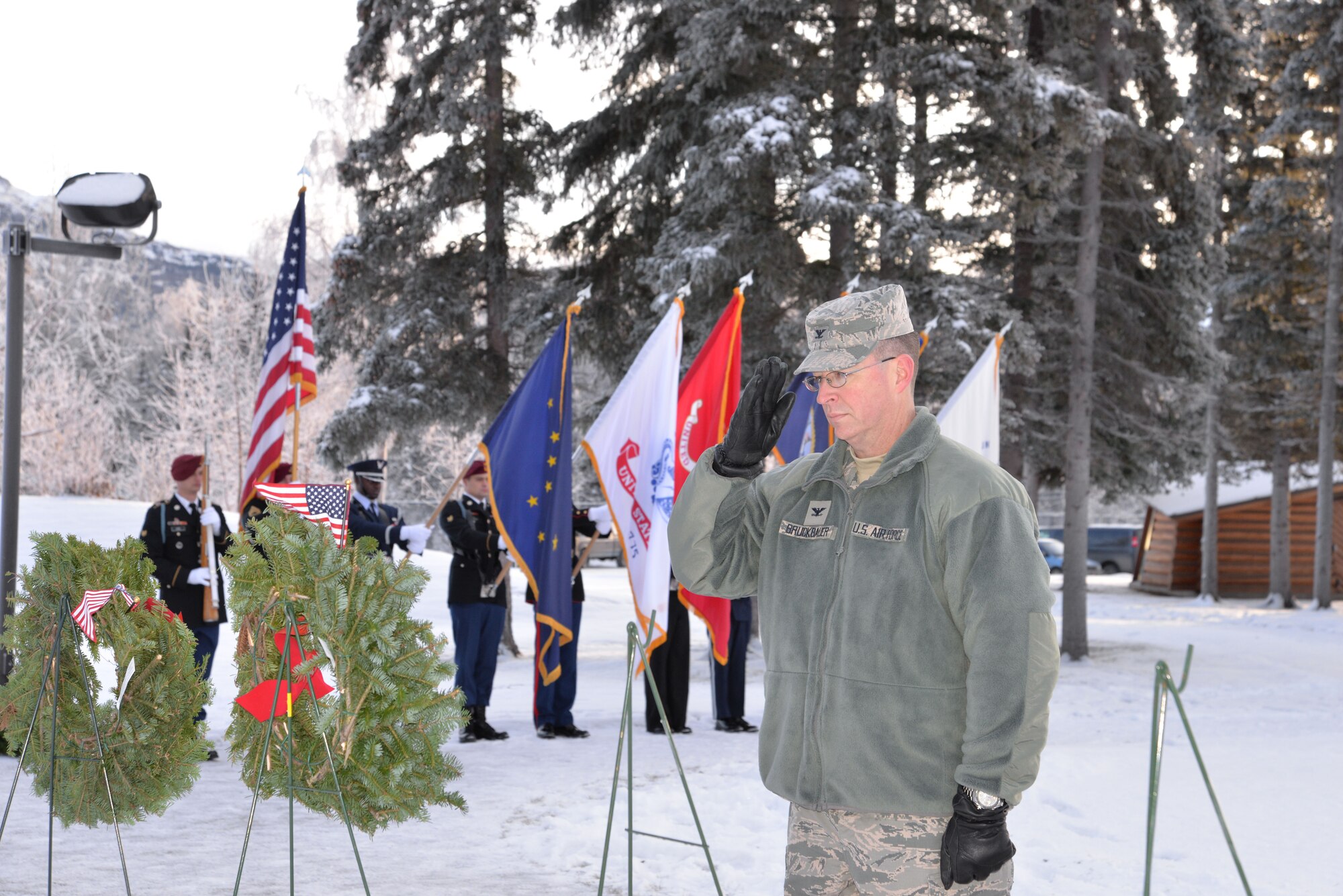 Air Force Col. Brian Bruckbauer, commander of Joint Base Elmendorf-Richardson and 673d Air Base Wing places a wreath at Fort Richardson National Cemetery Dec. 13 during the local observance of “Wreaths Across America,” a nationwide program honoring fallen veterans each holiday season. (U.S. Air Force photo/Song Johnson)