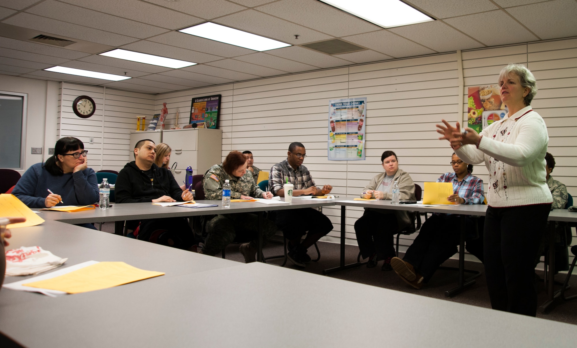 Lisa Schuette, 673d Aerospace Medical Squadron health educator and registered dietician, instructs a Better Body, Better Life class on Joint Base Elmendorf-Richardson, Alaska, Dec. 10, 2014. The BBBL program is an Air Force weight-management program designed to help individuals who are looking to lose and maintain their weight and live a healthy lifestyle. The program consists of five classes providing information about portion sizes, sugars, how to read food labels and maintaining healthier eating habits. (U.S. Air Force photo/Airman 1st Class Tammie Ramsouer)