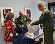 BOARDMAN, Ohio—Lt. Col. John “Chinky” Kochansky and Lt. Col. Chris Zwetzig, navigators with Youngstown Air Reserve Station’s 757th Airlift Squadron, visit and give gifts to a child at Akron Children’s Hospital Dec. 17, 2014. Six Service members from Youngstown Air Reserve Station went to the hospital to deliver toys and visit children as a community outreach event. U.S. Air Force photo/Eric M. White