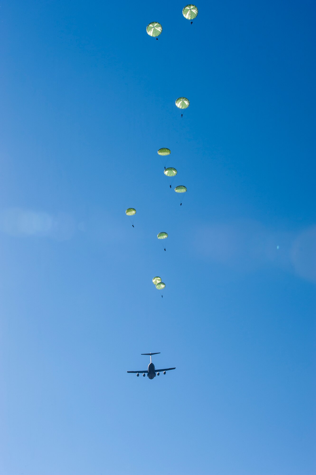 Airmen from the 820th Base Defense Group perform static-line jumps Dec. 12, 2014, over Moody Air Force Base, Ga. The 820th BDG jumps regularly to maintain their readiness and capabilities. (U.S. Air Force photo by Airman 1st Class Ryan Callaghan/Released)

