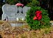 A wreath lays on a veterans grave Dec. 13 at the Mount Hope Cemetery in Lynn Haven, Fla. Wreaths were placed on graves as part of the Wreaths Across America Day event, that pays respect and honor to military members that have fallen. (U.S. Air Force photo by Airman 1st Class Sergio A. Gamboa) 