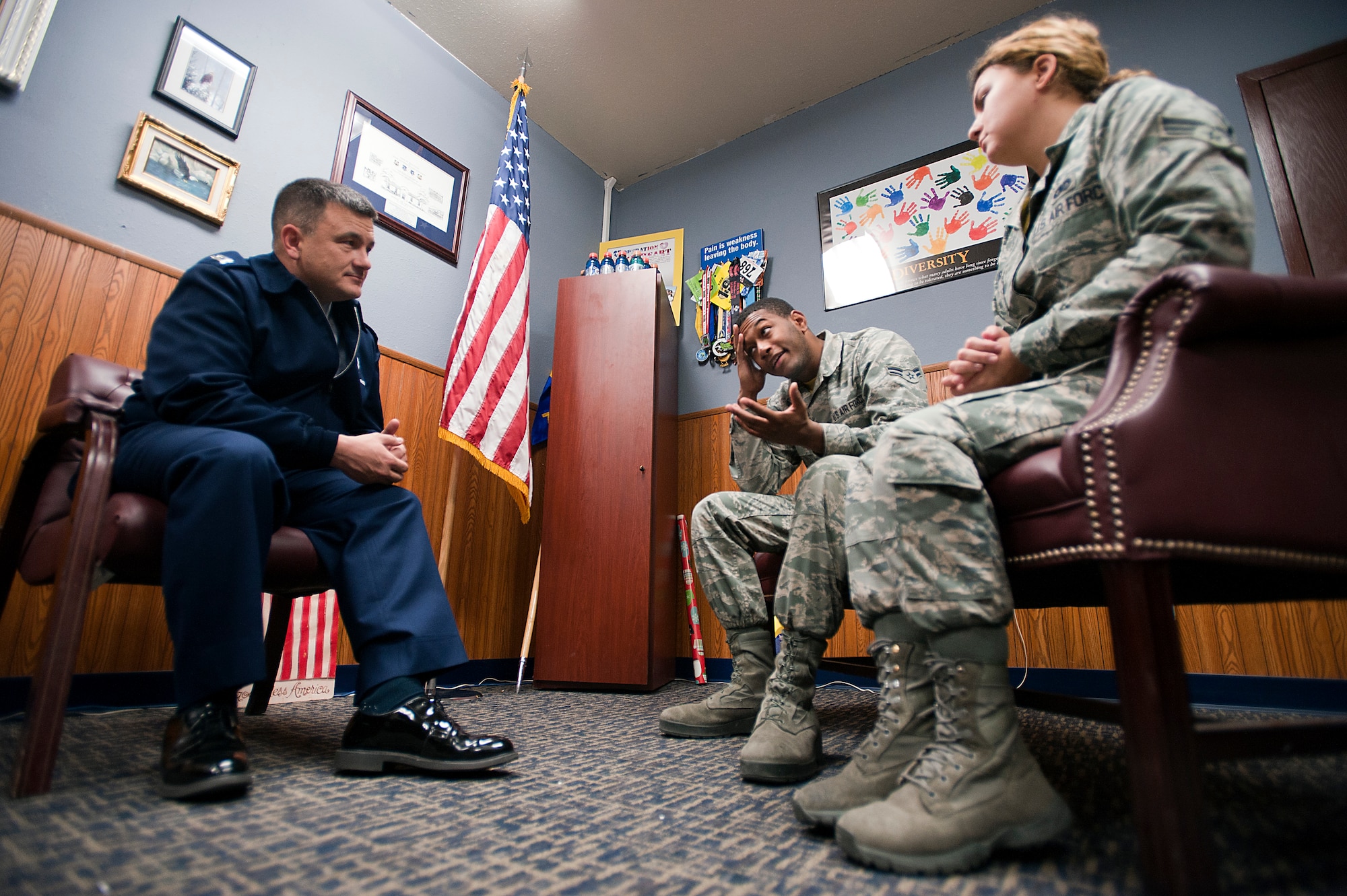 Chaplain (Capt.) Jason, Klodnicki, a 99th Air Base Wing chaplain, helps coworkers find a solution to their problems during a counseling session at Nellis Air Force Base, Nev., Dec. 12, 2014. The Nellis chapel will be hosting a relationship seminar Jan. 9, open to all ID card holders -- whether they’re single, married, divorced or wanting to improve coworker relationships -- from 6 to 9 p.m. at the Nellis Club. Contact the chapel at 702-652-2950 for sign up information. (U.S. Air Force photo by Senior Airman Timothy Young)