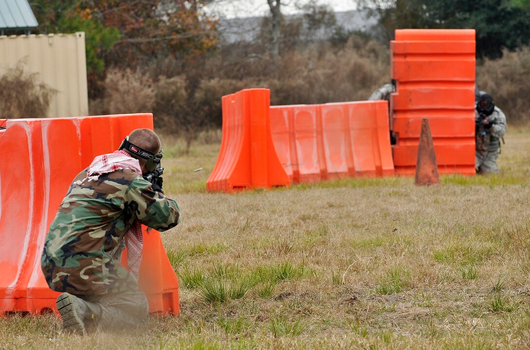 U.S. Air Force Airmen participate in a cover and concealment Security Forces challenge during Valiant Eagle 2014 at the 125th Fighter Wing, Jacksonville Fla. on December 5, 2014. (U.S. Air Force photo by Master Sgt. Jaclyn Lyons\Released)