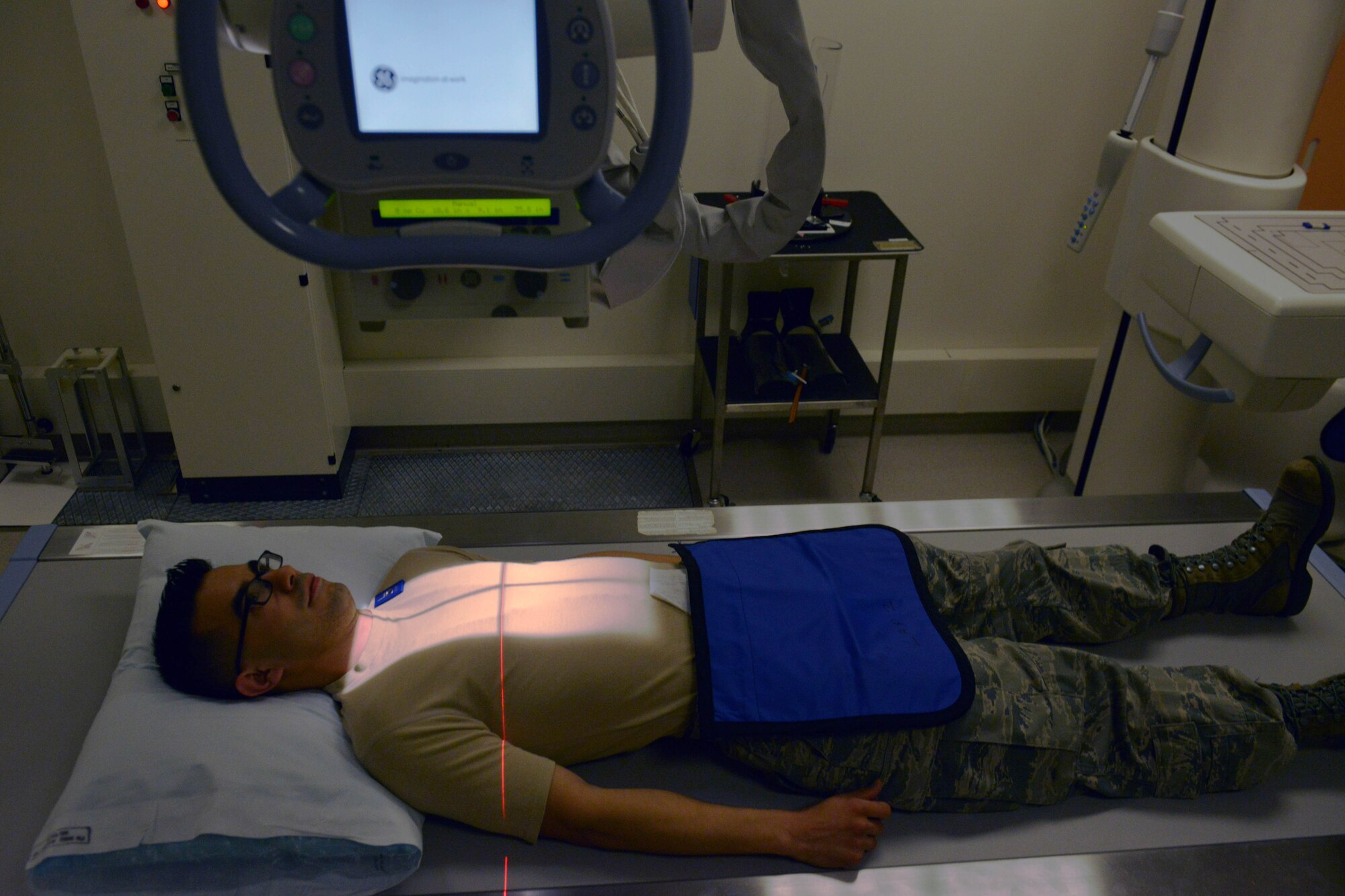 Senior Airman Gilberto Miramontes, 31st Medical Operations Squadron, is x-rayed, Dec. 16, 2014, at Aviano Air Base, Italy. Radiologist technicians capture imagery to give an accurate representation of what’s going on in a patient’s body to help the doctor diagnose physical problems. (U.S. Air Force photo/Airman 1st Class Ryan Conroy)   