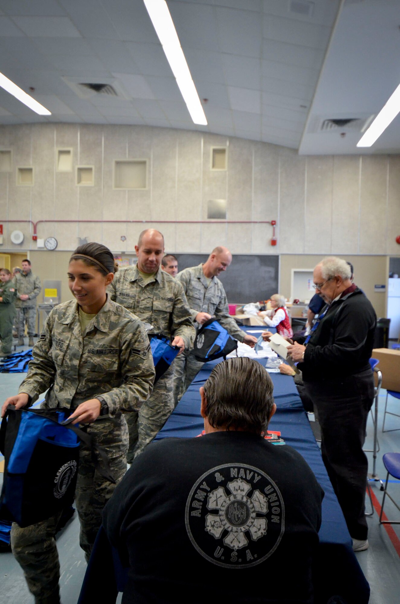 U.S. Airmen with the 128th Air Refueling Wing help assemble gifts to pass out to patients at the Clement J. Zablocki VA Medical Center, Milwaukee Dec. 10, 2014.  (U.S. Air National Guard photo by Tech. Sgt. Jenna Lenski/Released)