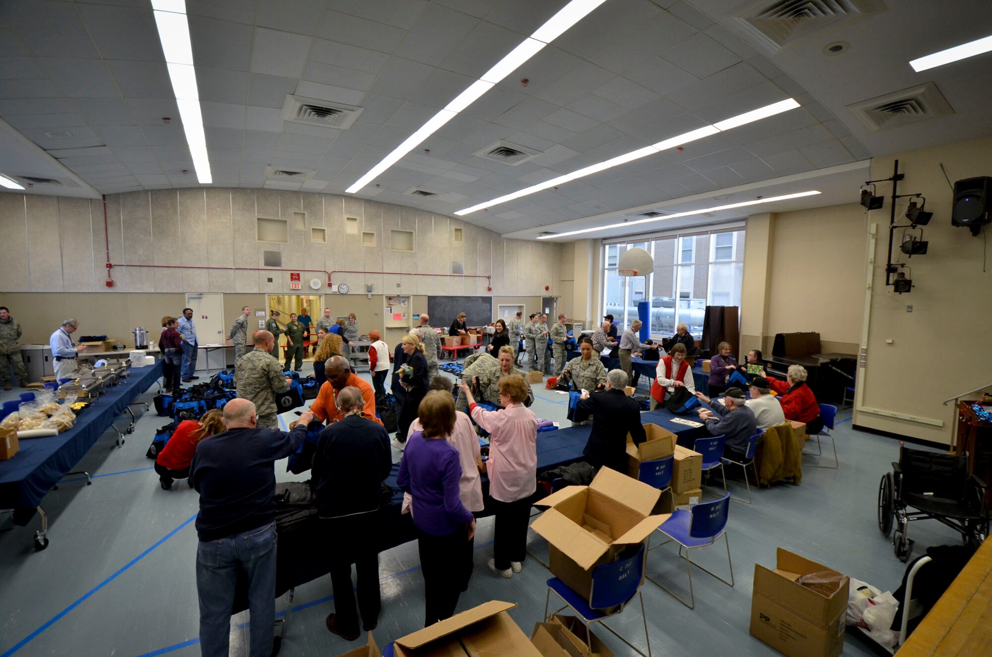 U.S. Airmen with the 128th Air Refueling Wing help assemble gifts to pass out to patients at the Clement J. Zablocki VA Medical Center, Milwaukee Dec. 10, 2014.  (U.S. Air National Guard photo by Tech. Sgt. Jenna Lenski/Released)