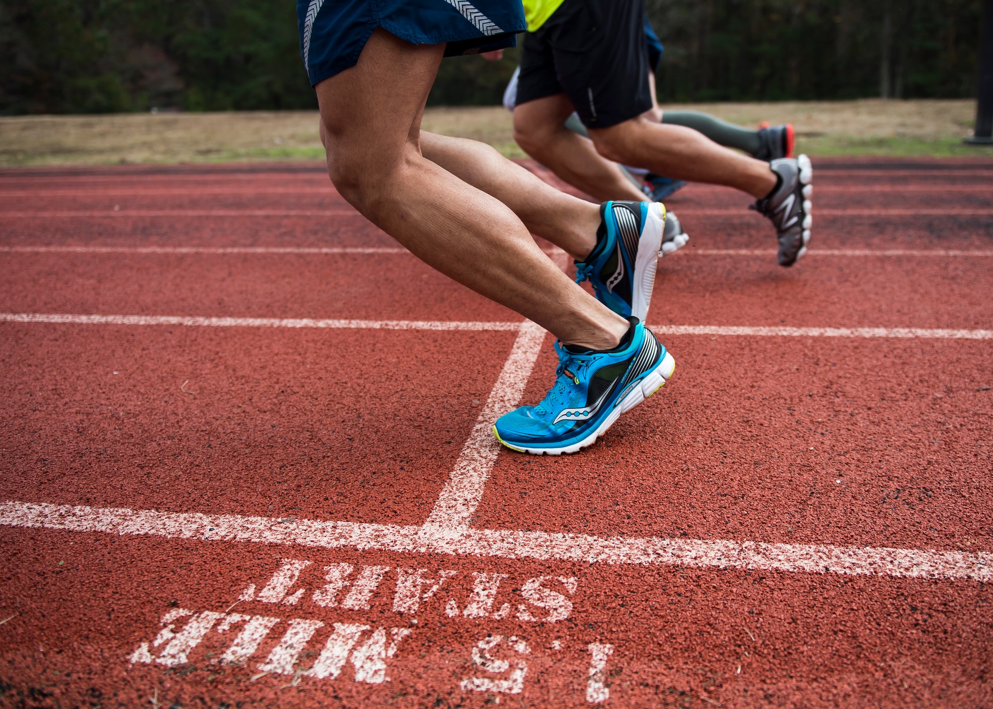 Airmen begin a timed mile and a half run around the Joint Base Charleston track, Dec. 9, 2014, during a practice Physical Ability and Stamina Test at Joint Base Charleston, S.C. The event was hosted by Tech. Sgt. Ismael Villegas, a combat controller who is a two-time Silver Star recipient and an Air Force Special Operations Command in-service recruiter. (U.S. Air Force photo/Senior Airman Jared Trimarchi) 