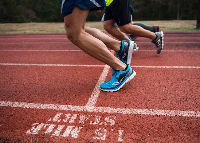 Airmen begin a timed mile and a half run around the Joint Base Charleston track, Dec. 9, 2014, during a practice Physical Ability and Stamina Test at Joint Base Charleston, S.C. The event was hosted by Tech. Sgt. Ismael Villegas, a combat controller who is a two-time Silver Star recipient and an Air Force Special Operations Command in-service recruiter. (U.S. Air Force photo/Senior Airman Jared Trimarchi) 