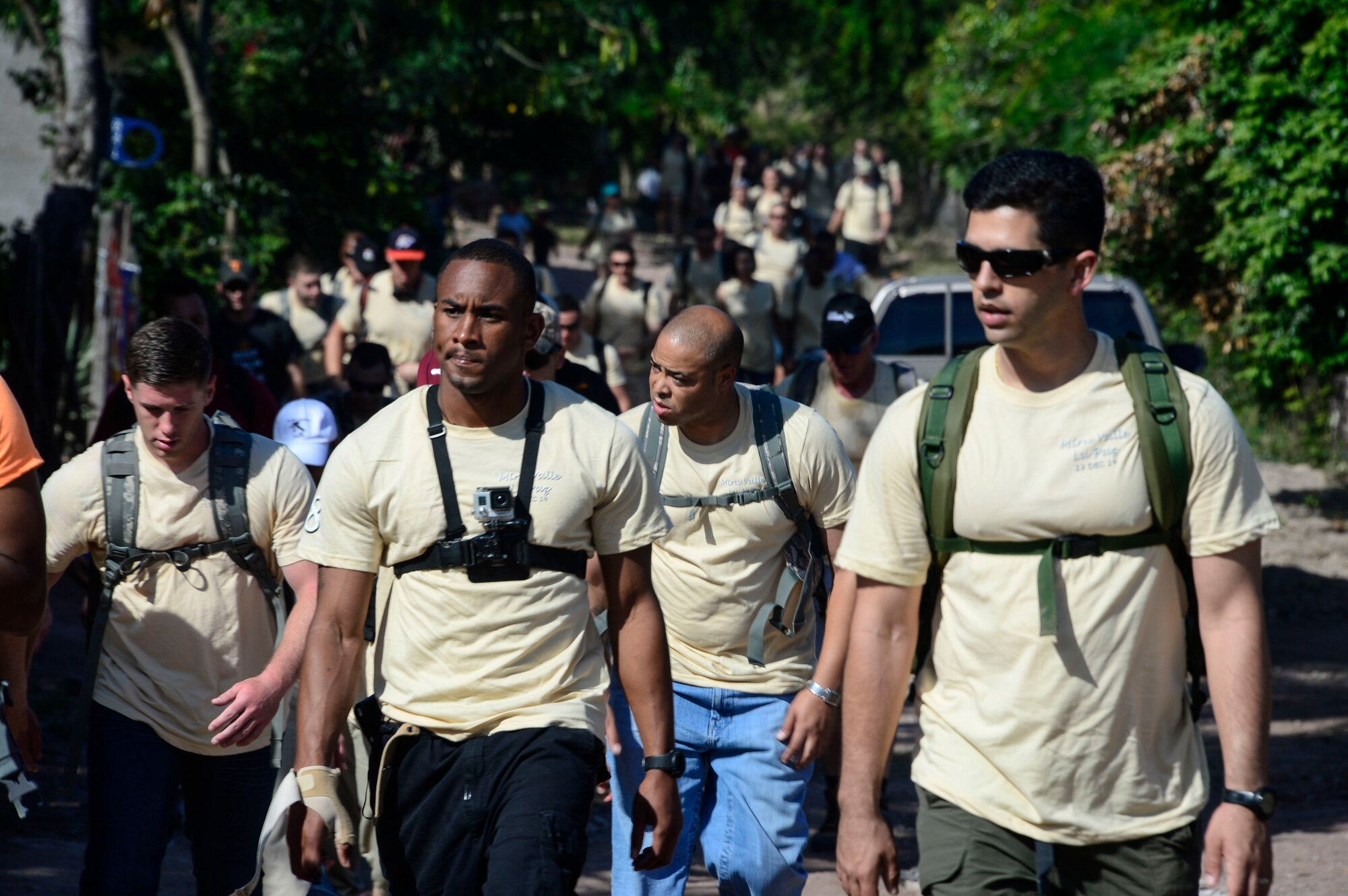 Volunteers arrive in Mira Valle carrying 35-pounds of food in their backpacks for the villagers of Mira Valle, La Paz, Honduras, Dec. 13, 2014. As part of the 58th Chapel Hike, over 130167 members assigned to Joint Task Force-Bravo trekked over three miles to help deliver over 3,5002,500-pounds of donated dry goods to villagers in need. Since the chapel hikes originated in 2007, over 9,700 service members have donated over $170,000 and volunteered their time to deliver more than 209,000 pounds of food and supplies to several remote villages. (U.S. Air Force photo/Tech. Sgt. Heather Redman)