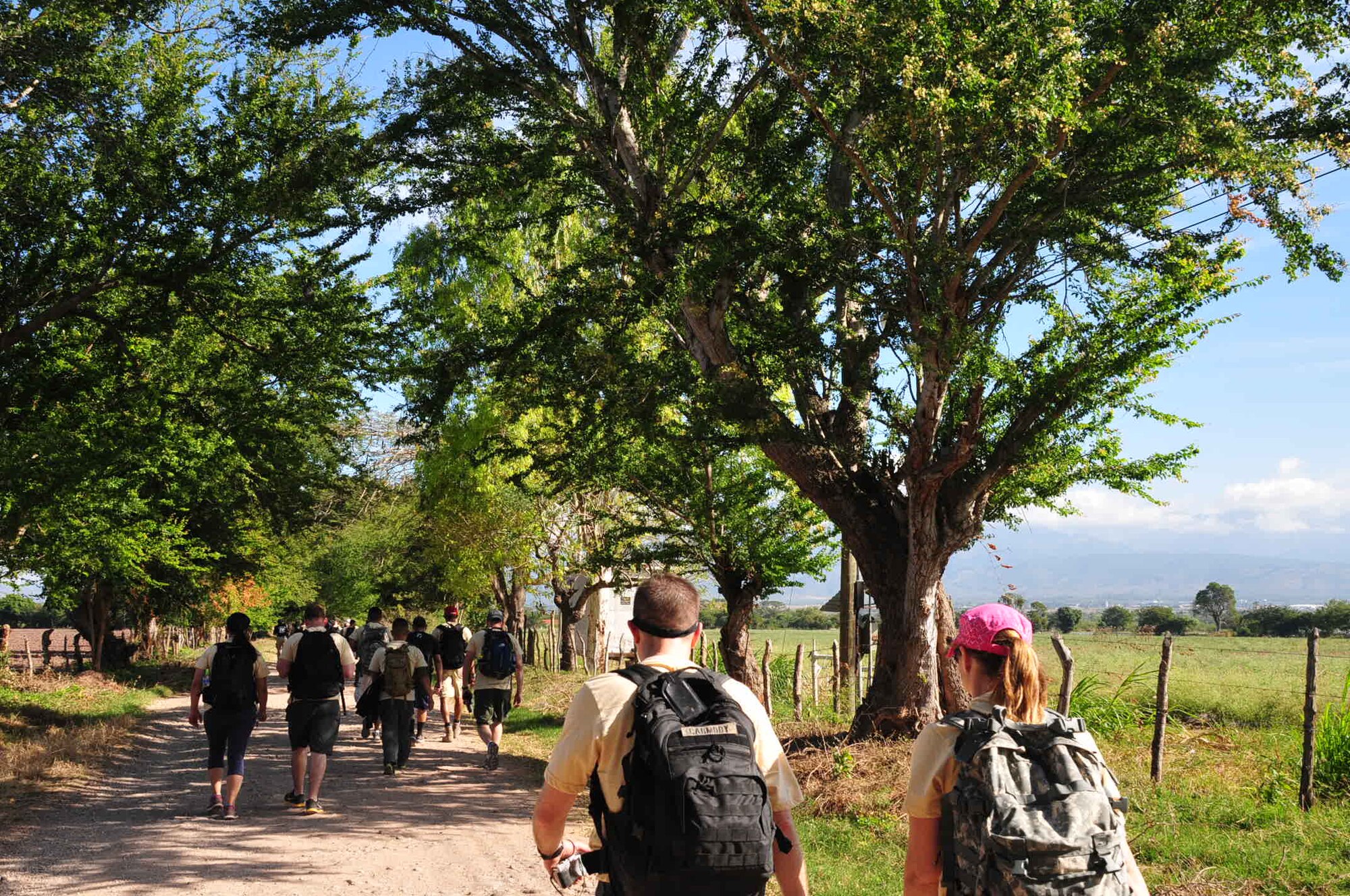 Volunteers carry 35-pounds of food in backpacks to villagers Mira Valle, La Paz, Honduras, Dec. 13, 2014. As part of the 58th Chapel Hike, 167over 130 members assigned to Joint Task Force-Bravo trekked over three miles to help deliver over 2,5003,500-pounds of donated dry goods to villagers in need. Since the chapel hikes originated in 2007, over 9,700 service members have donated over $170,000 and volunteered their time to deliver more than 209,000 pounds of food and supplies to several remote villages. (U.S. Air Force photo/Capt. Connie Dillon)