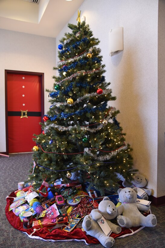 Children received gifts during the Hearts Apart Deployed Families Holiday Party at the Joint Base Andrews’ Theater, Dec. 13, 2014. Free family portraits, a scavenger hunt, DJ, food and giveaways were featured at the event. (U.S. Air Force photo/Airman 1st Class J.D. Maidens)