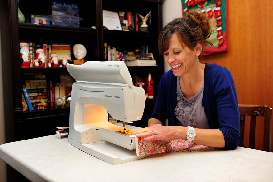 Britt Wills, founder of the Hodja Patchwork Piecers, sews a quilt for an expectant mother Dec. 3, 2014, at Incirlik Air Base, Turkey. The Hodja Patchwork Piecers make quilts to give to expectant mothers participating in the Storknesting program while stationed at Incirlik. (U.S. Air Force photo by Senior Airman Krystal Ardrey/Released)