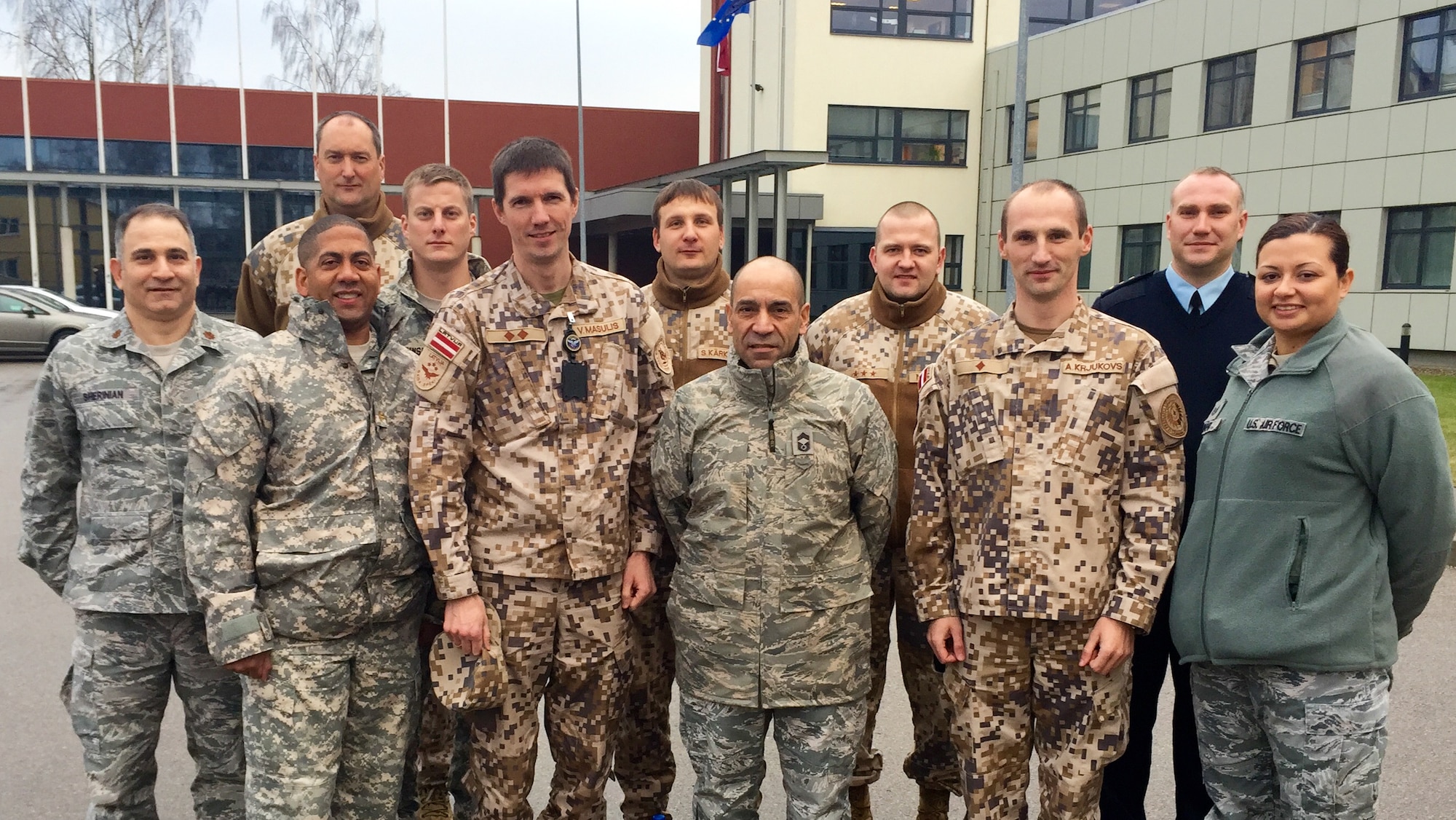 Air Advisors from the 435th Air Ground Operations Wings Contingency Response Group, Detachment-1 pose with Latvian Air Force airmen during a weeklong event to build partnerships Dec. 9, 2014, at Joint Forces Headquarters, Riga, Latvia. During a five-day trip, the air advisors formed a working group to develop the Latvian Air Force and help support Baltic policing efforts. (Courtesy Photo) 