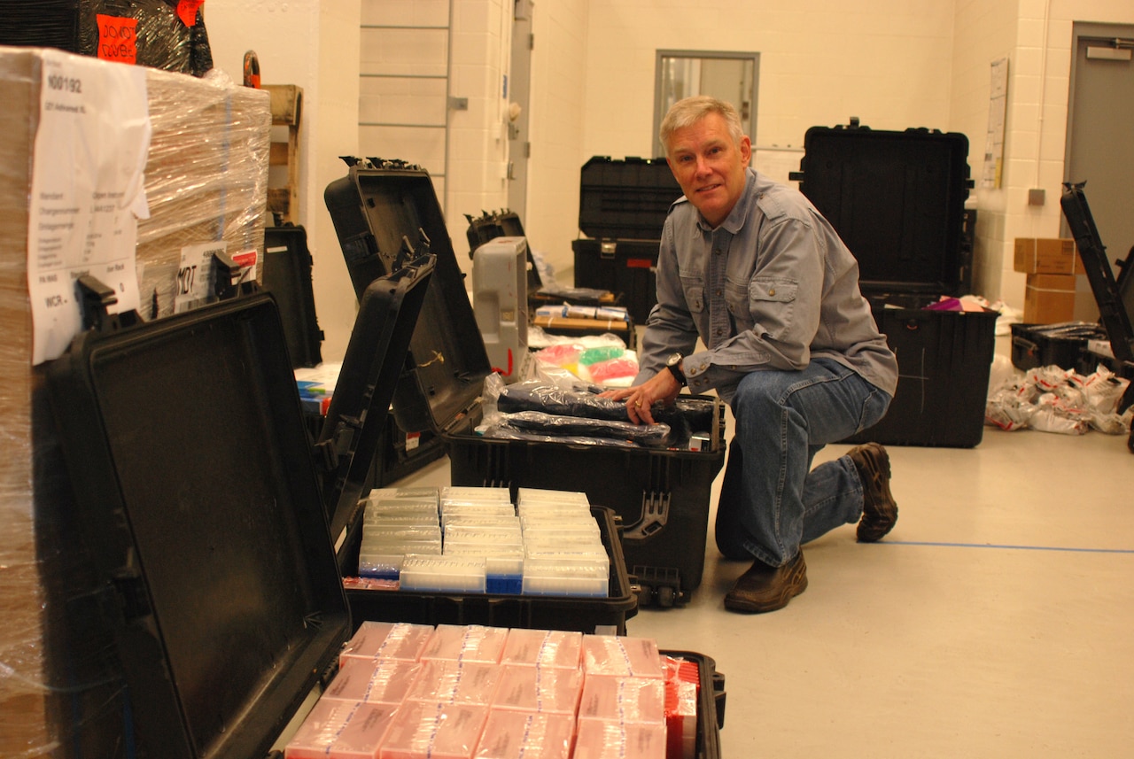 Dr. Randal J. Schoepp with the U.S. Army Medical Research Institute of Infectious Diseases at Fort Detrick, Maryland, inspects packing cases filled with laboratory supplies before departing for Liberia to support Ebola virus diagnostic efforts. U.S. Army photo by William F. Discher