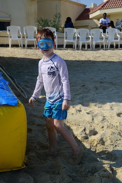 A U.S. servicemember’s child enjoys a day on the beach along the Persian Gulf during the Qatari Minister of Defense’s Beach House event, Dec. 13, 2014, near Al Khor, Qatar. Qatar Minister of Defense, Maj. Gen. Hamad Al-Attiyah, invites U.S. servicemembers deployed to Al Udeid Air Base and Camp As Sayliyah, Qatar; their families, as well as Department of Defense civilians, to his beach house every a year as a gesture of friendship and good will.  Some of the activities at the beach house event included deep sea fishing, Qatari tea, camel rides and hookah. (U.S. Air Force photo by Capt. Sarah Babcock)