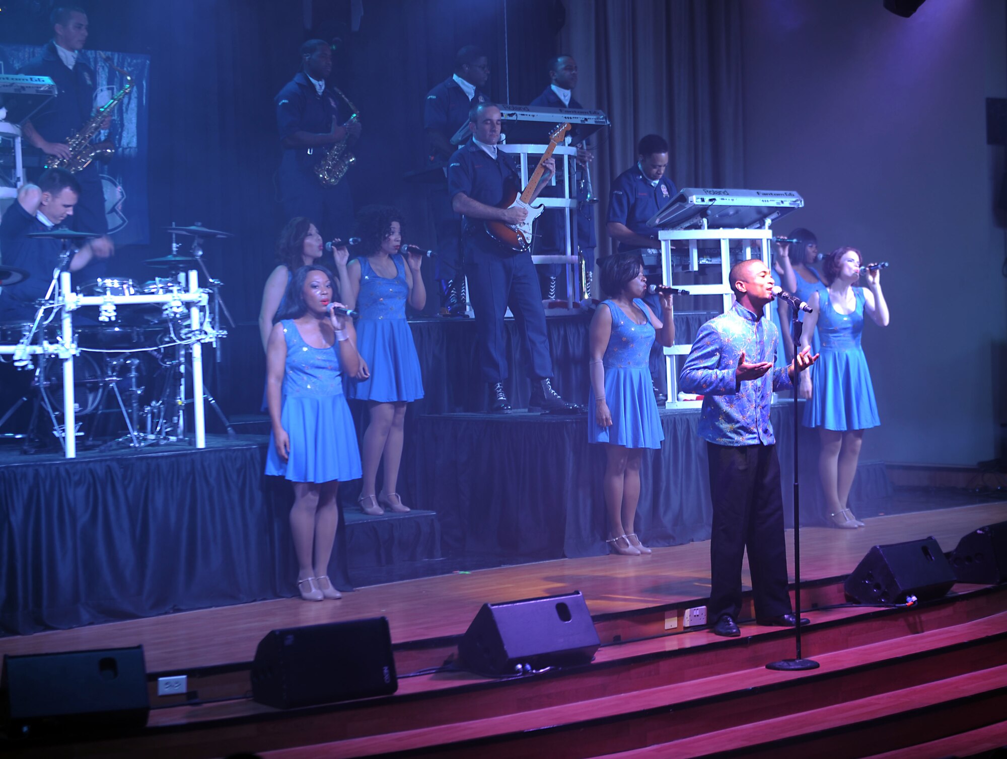 Tops in Blue performs for the 386th Air Expeditionary Wing at The Rock on Dec. 16, 2014. The group performed popular music from a variety of genres. (U.S. Air Force photo by Master Sgt. Eric Petosky)