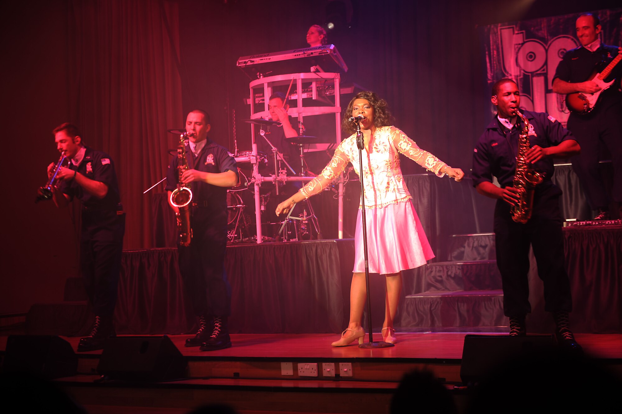 Tops in Blue performs for the 386th Air Expeditionary Wing at The Rock on Dec. 16, 2014. The group performed popular music from a variety of genres. (U.S. Air Force photo by Master Sgt. Eric Petosky)