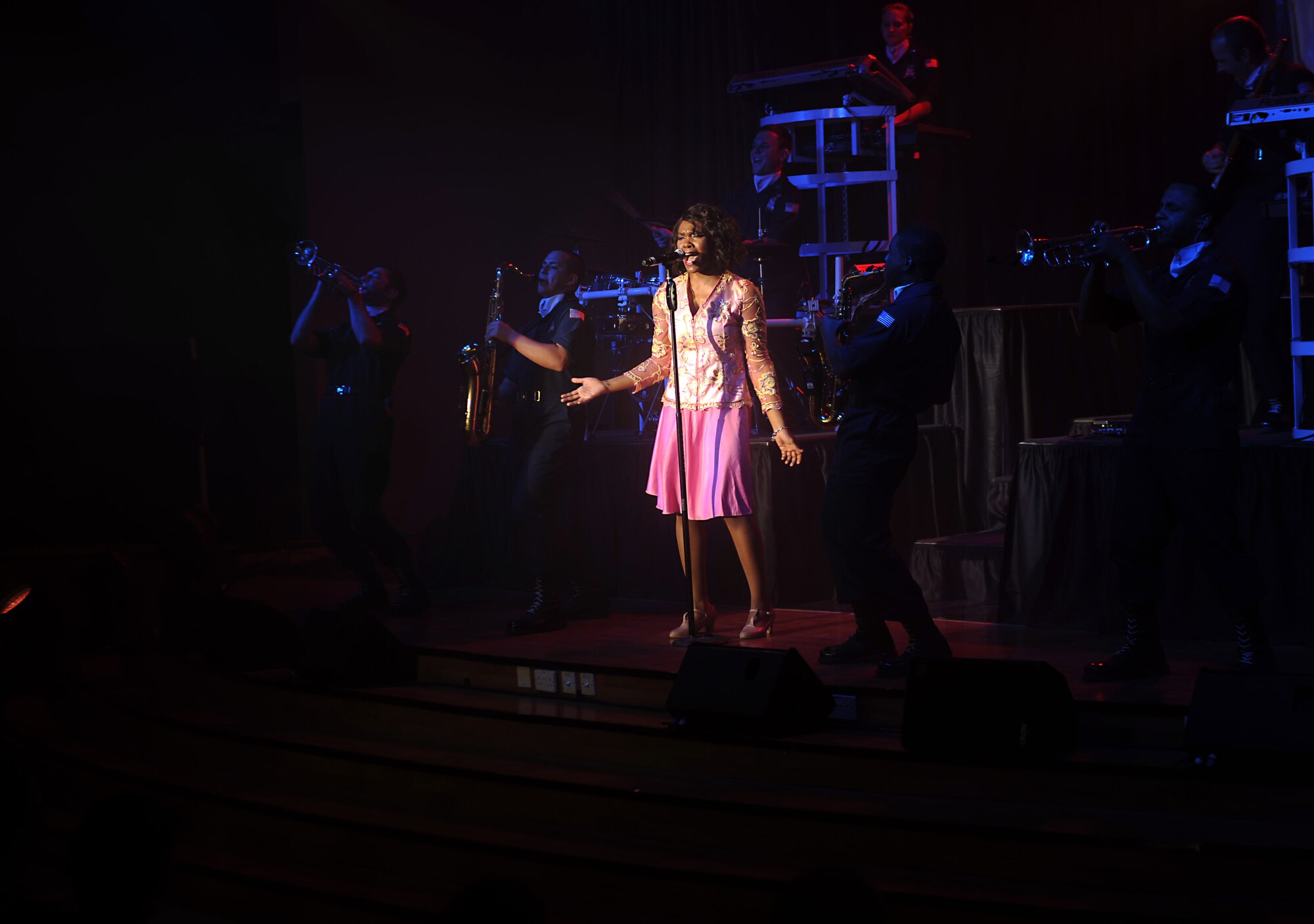 Tops in Blue performs for the 386th Air Expeditionary Wing at The Rock on Dec. 16, 2014. The group performed popular music from a variety of genres. (U.S. Air Force photo by Master Sgt. Eric Petosky)