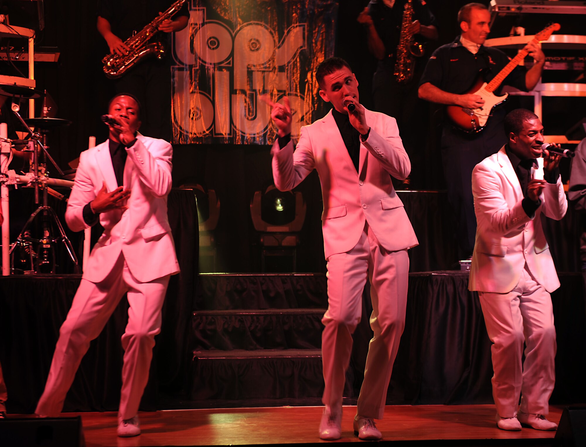 Tops in Blue performs for the 386th Air Expeditionary Wing at The Rock on Dec. 16, 2014. The group performed popular music from a variety of genres. (U.S. Air Force photo by Master Sgt. Eric Petosky)