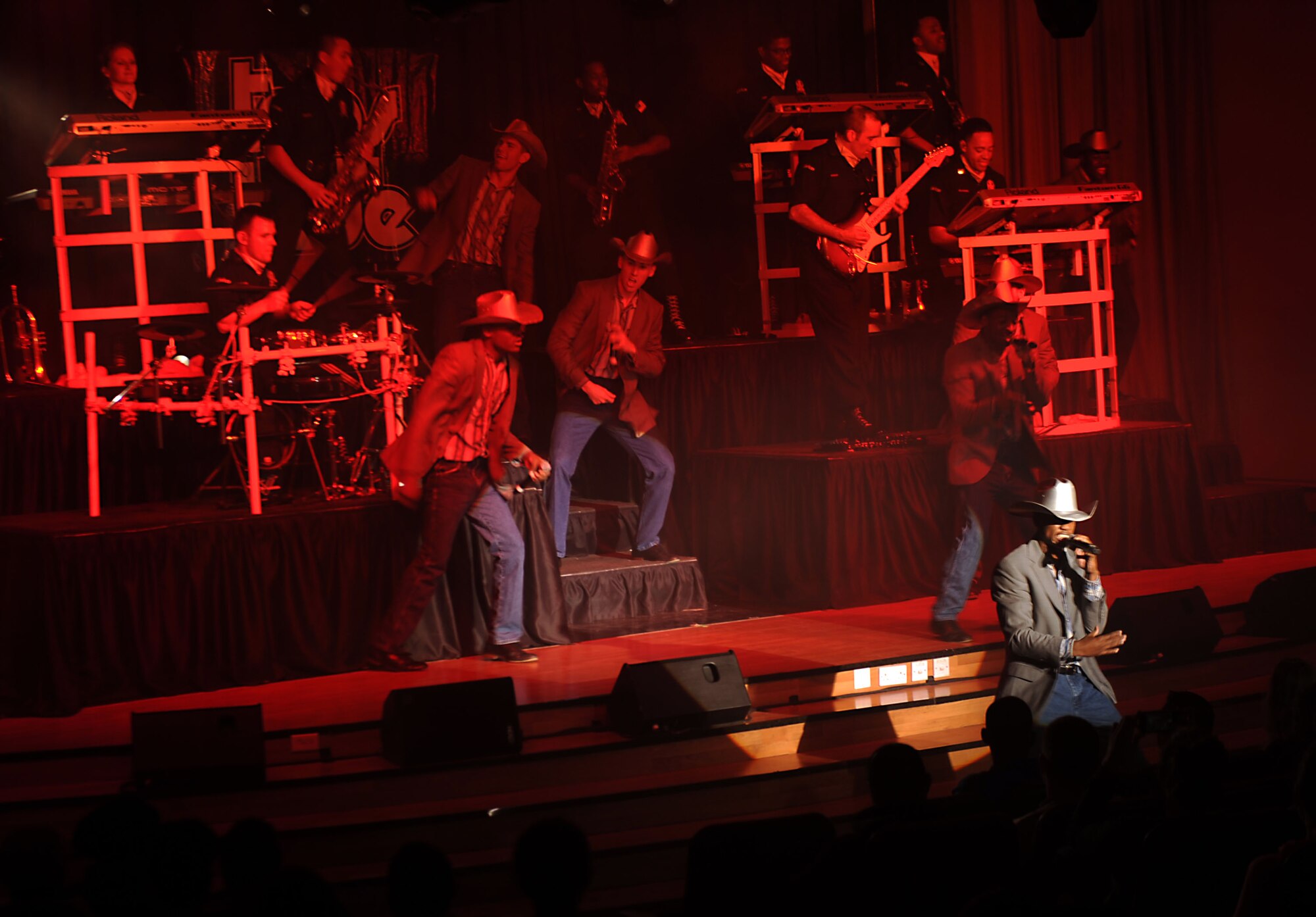 Tops in Blue performs for the 386th Air Expeditionary Wing at The Rock on Dec. 16, 2014. The group performed popular music from a variety of genres. (U.S. Air Force photo by Master Sgt. Eric Petosky)