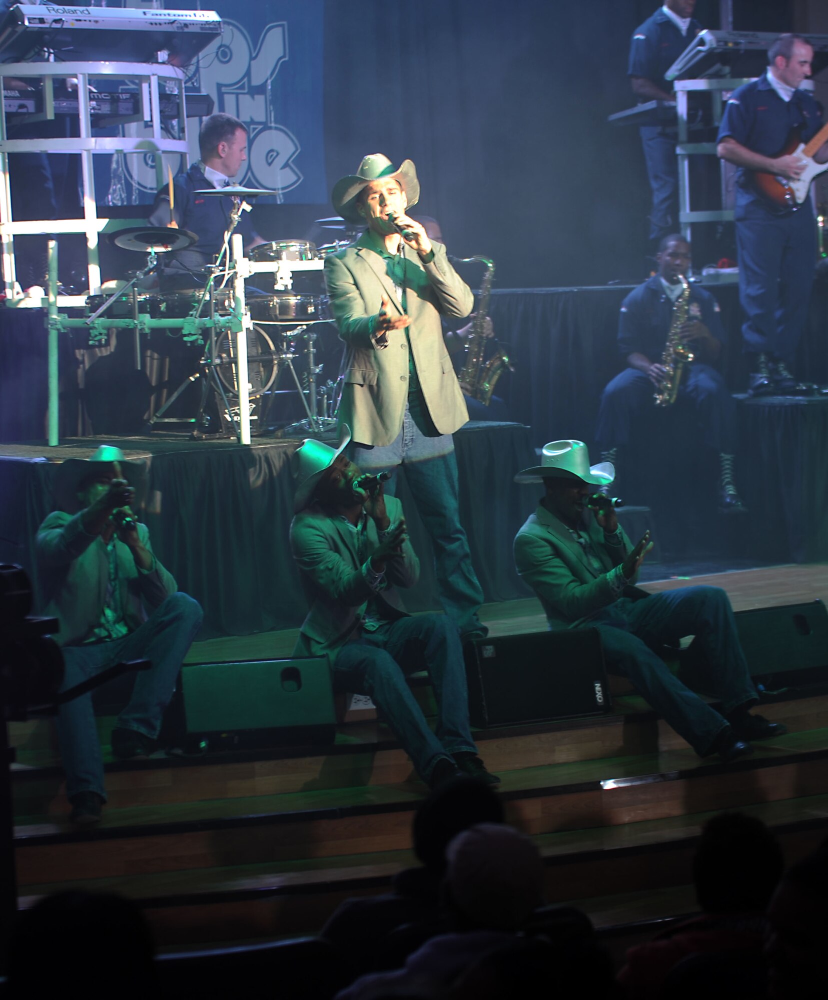 Tops in Blue performs for the 386th Air Expeditionary Wing at The Rock on Dec. 16, 2014. The group performed popular music from a variety of genres. (U.S. Air Force photo by Master Sgt. Eric Petosky)