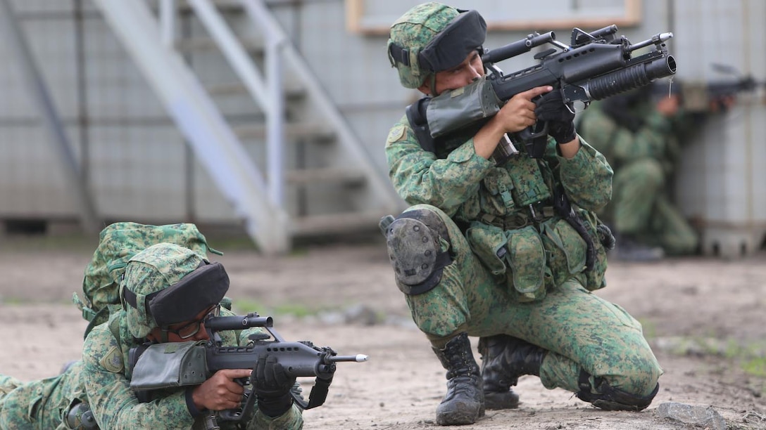 Marines with 1st Battalion, 5th Marine Regiment, 1st Marine Division, along with elements of the 7th Singaporean Infantry Brigade, clear a combat town as part of Exercise Valiant Mark 14.2 aboard Camp Pendleton, Calif., Dec. 15, 2014. Exercise Valiant Mark enhances the United States and Singaporean armed forces’ combined combat readiness through live-fire and urban terrain training as well as amphibious operations familiarization.