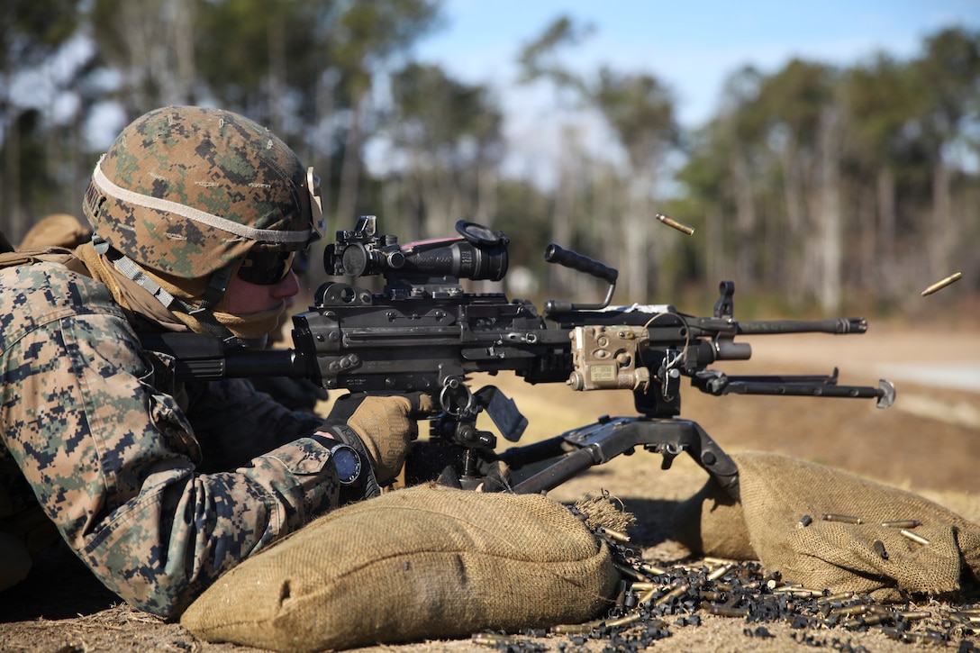Lance Cpl. Michael Hobbs, an anti-tank missleman with 1st Battalion, 8th Marine Regiment and native of Phoenix, Arizona, fires an M249 light machine gun at G-21 Machine Gun Range aboard Camp Lejeune, N.C., Dec. 11, 2014.  Marines with the battalion conducted training to improve their skills with the M249 while engaging various targets at unknown distances.  (U.S. Marine Corps photo taken by Lance Cpl. Alex Mitchell/released)