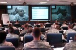 Soldiers in a Master Resiliency Training class at Fort Hood, Texas, interact via video teleconference with Soldiers, including Sgt. First Class Steven Mashack of the Army National Guard's Soldiers and Family Support Division (on screen), at the University of Pennsylvania in Philadelphia, March 12, 2010. The 10-day MRT course, held at First Army Division West headquarters in conjunction with the Philadelphia class, is only the fourth Army-wide MRT session that has been held.