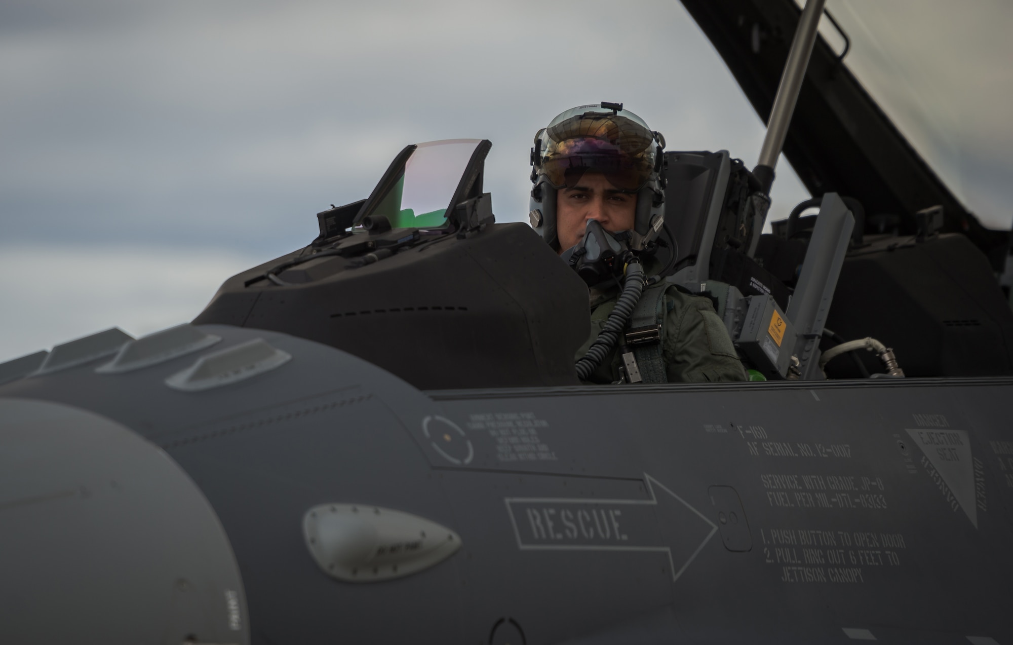 Iraqi air force captain Hama conducts preflight inspections while inside a new to service Iraqi F-16 Fighting Falcon Dec. 17, 2014, located at the nearby Tucson International Airport, Ariz. Hama was part of the first class of Iraqi students training with the 162nd Wing to further enhance interoperability between the two partner nations. (U.S. Air Force photo/Senior Airman Jordan Castelan)