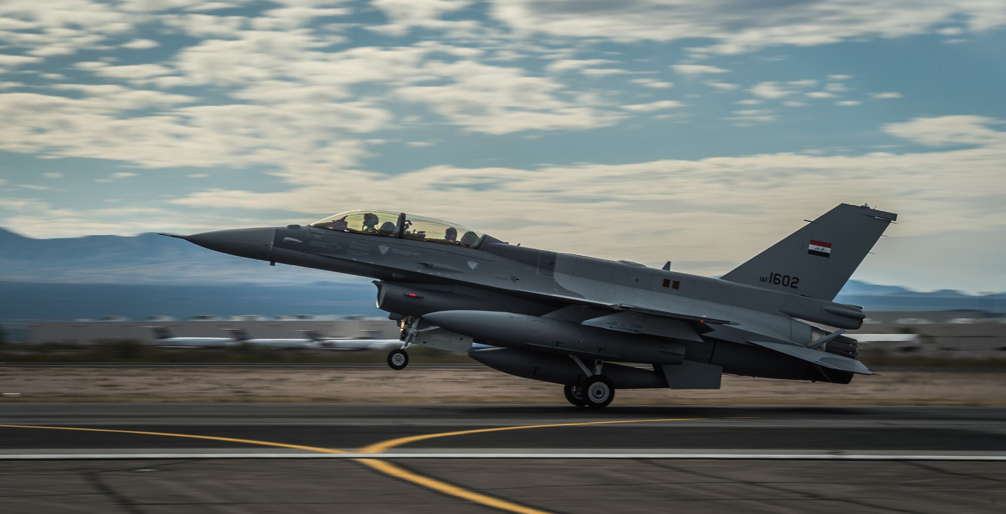 Lt. Col. Julian Pacheco and Iraqi air force captain Hama land one of the IAF's new  F-16 Fighting Falcon aircraft Dec. 16, 2014, at the Tucson International Airport, Ariz. Due to the current security situation in Iraq, the IAF pilots will complete their training in their own aircraft in the U.S. (U.S. Air Force photo/Senior Airman Jordan Castelan)