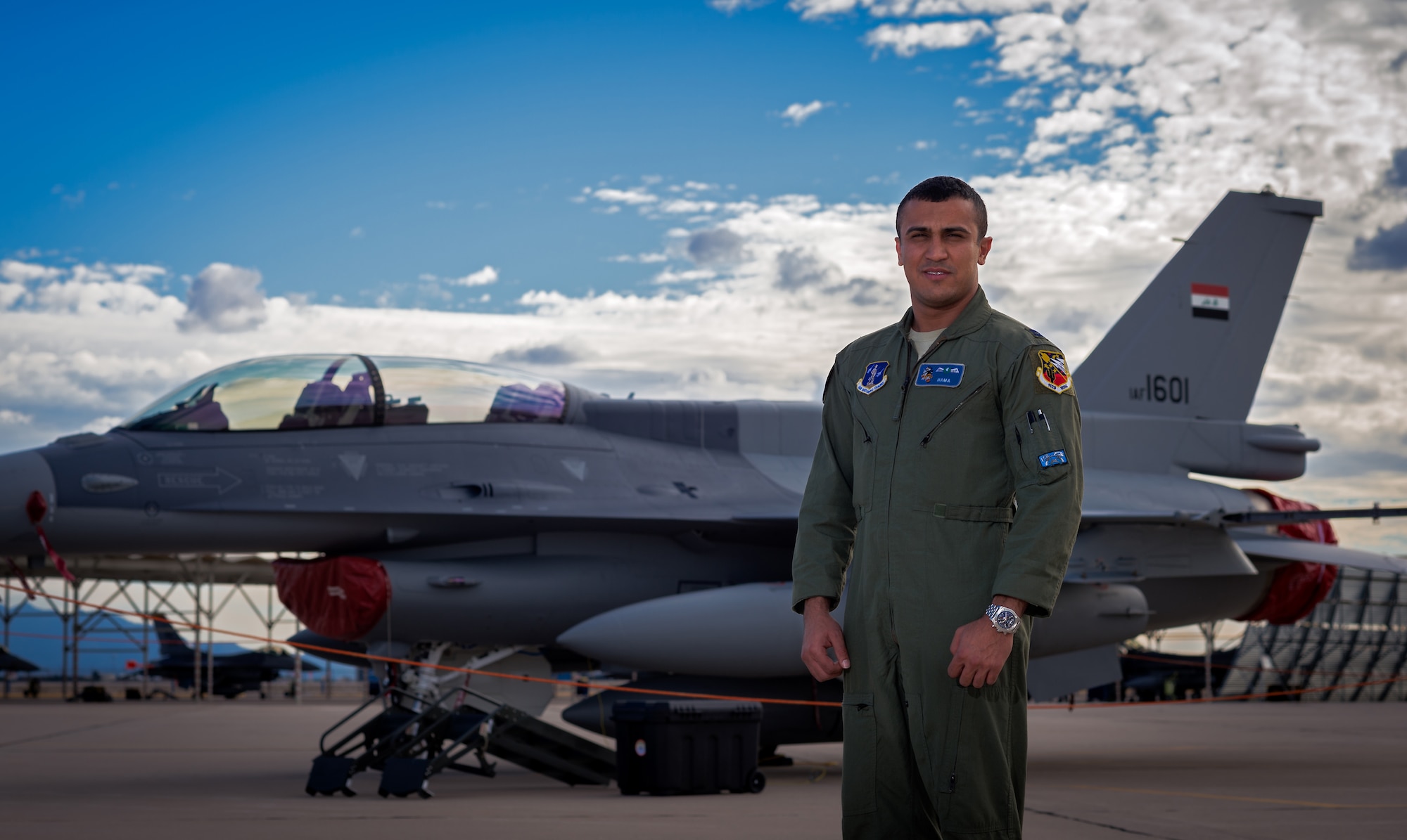 Iraqi air force captain Hama stands in front of one of the IAF F-16 Fighting Falcons Dec. 16, 2014 at Tucson International Airport, Ariz. Hama helped deliver one of the IAF's new F-16Ds to their training location. (U.S. Air Force photo/Senior Airman Jordan Castelan)
